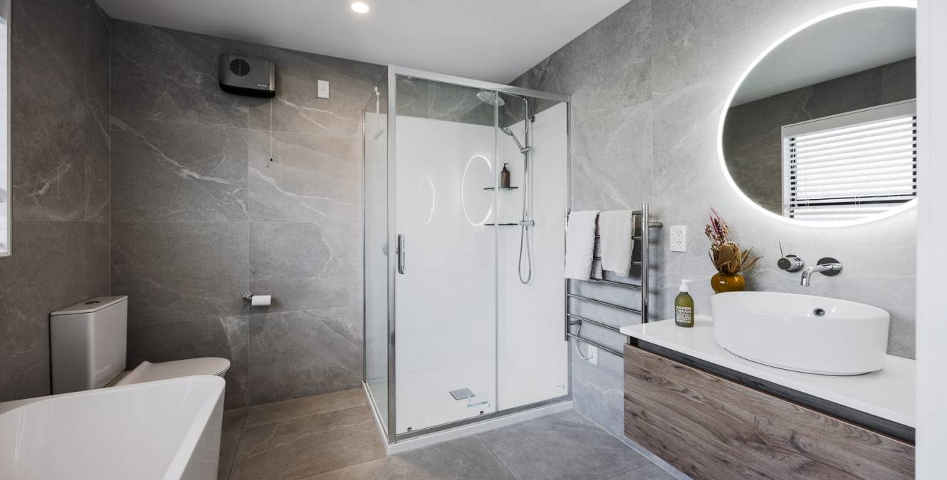 Shower, toilet, bath and vanity in luxury bathroom