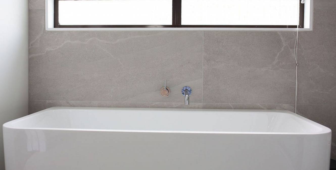 Floor to ceiling tiled modern luxury bathroom