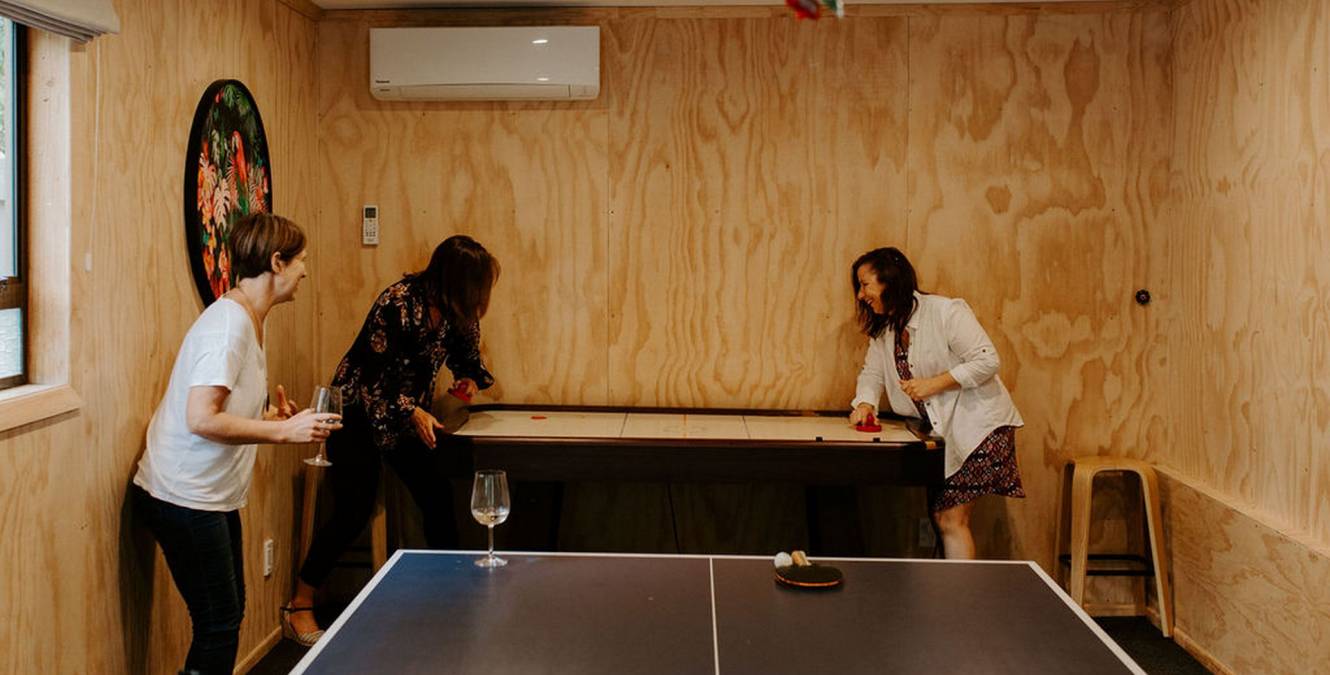 Games room - table tennis, air hockey and darts in luxury Kapiti retreat