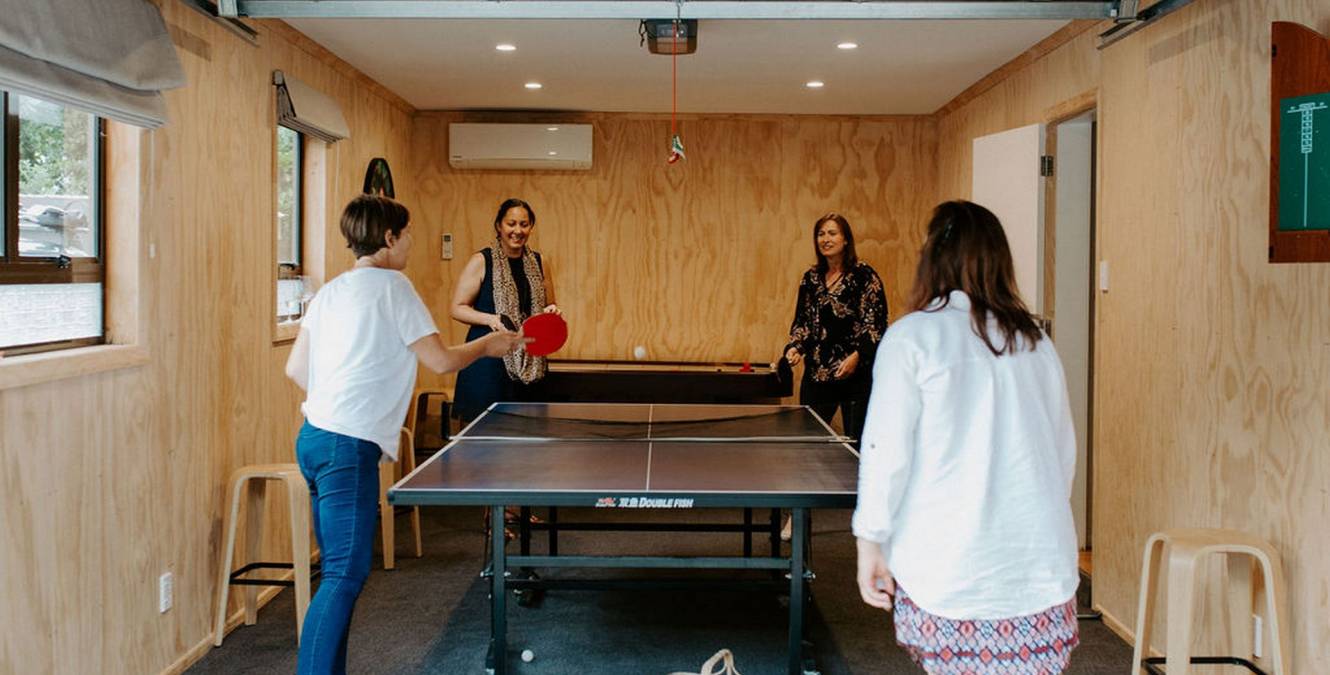 Games room - table tennis, air hockey and darts in luxury retreat